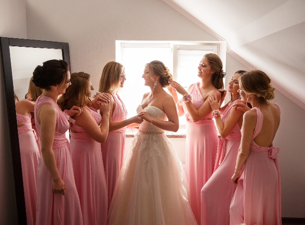 bride and bridesmaids getting ready