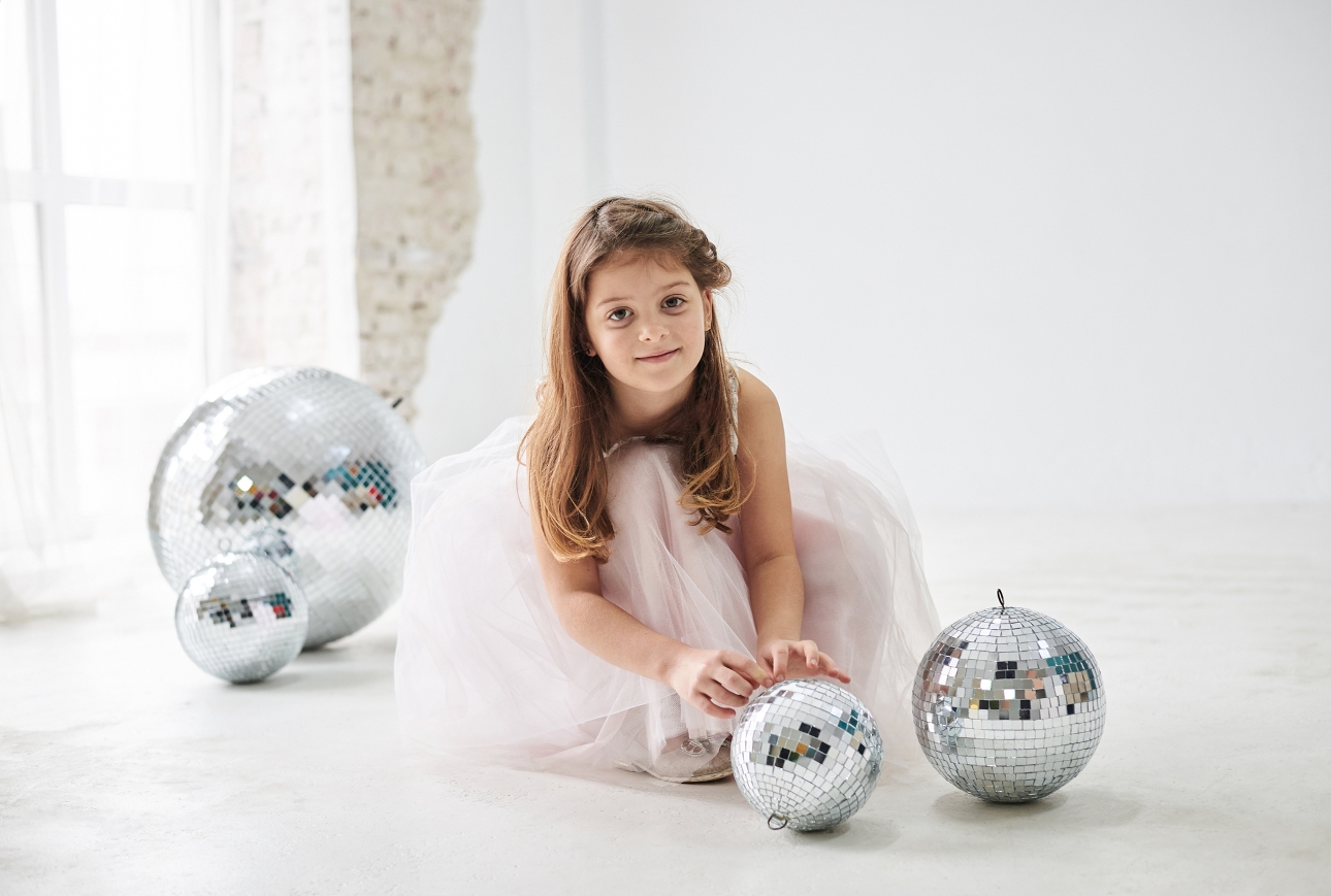 bridesmaid on floor surrounded by glitter disco balls