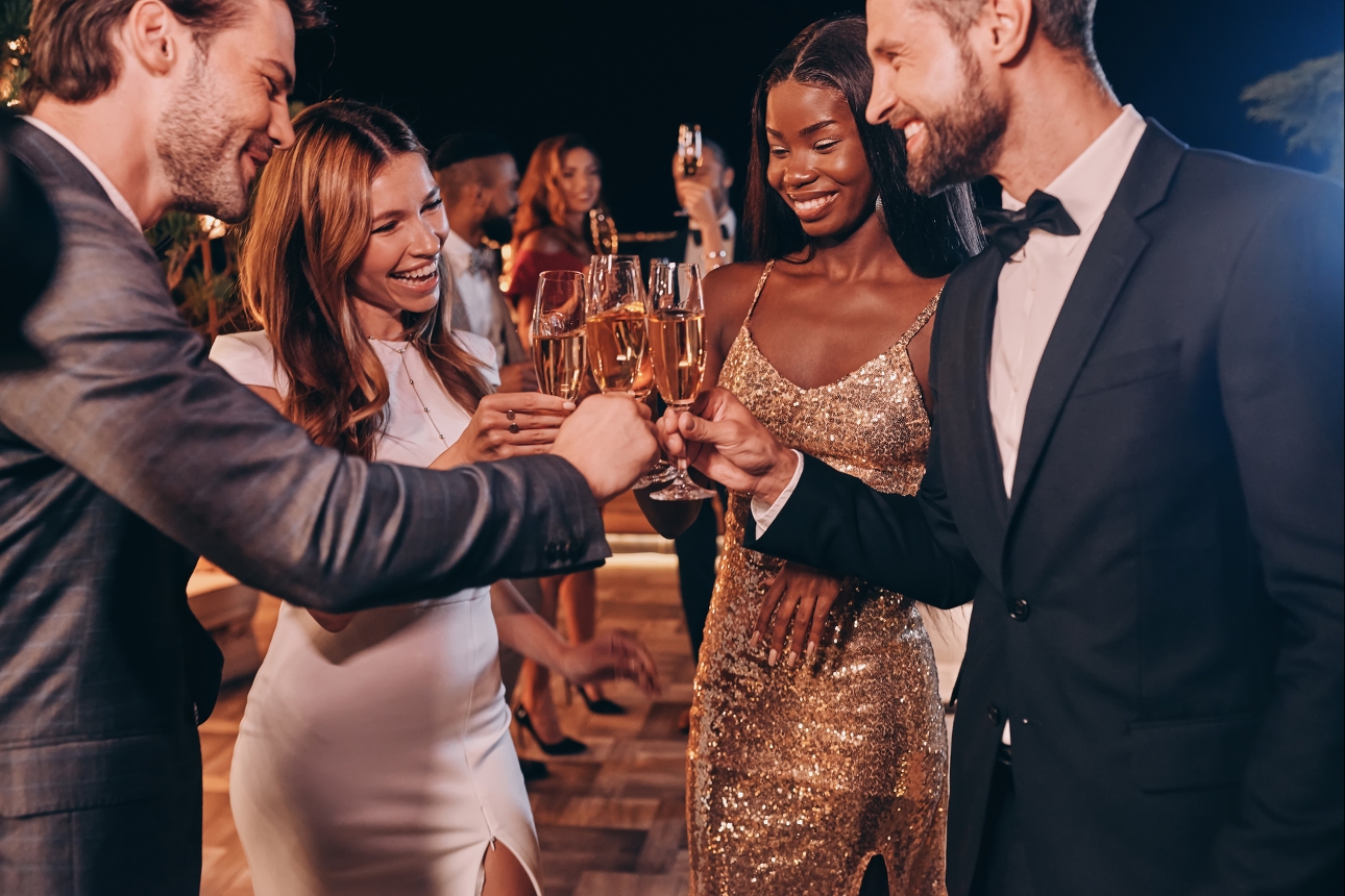 friends drinking at night in smart clothes